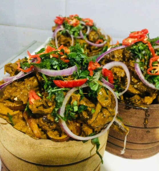 Traditional Eastern Nigerian recipe prepared with Goat meat, spices, seasonings, vegetables and palm oil.